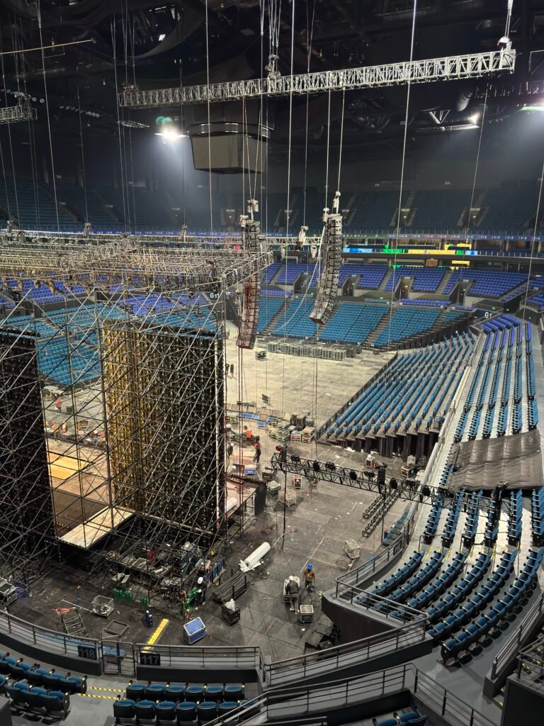line array speakers being installed